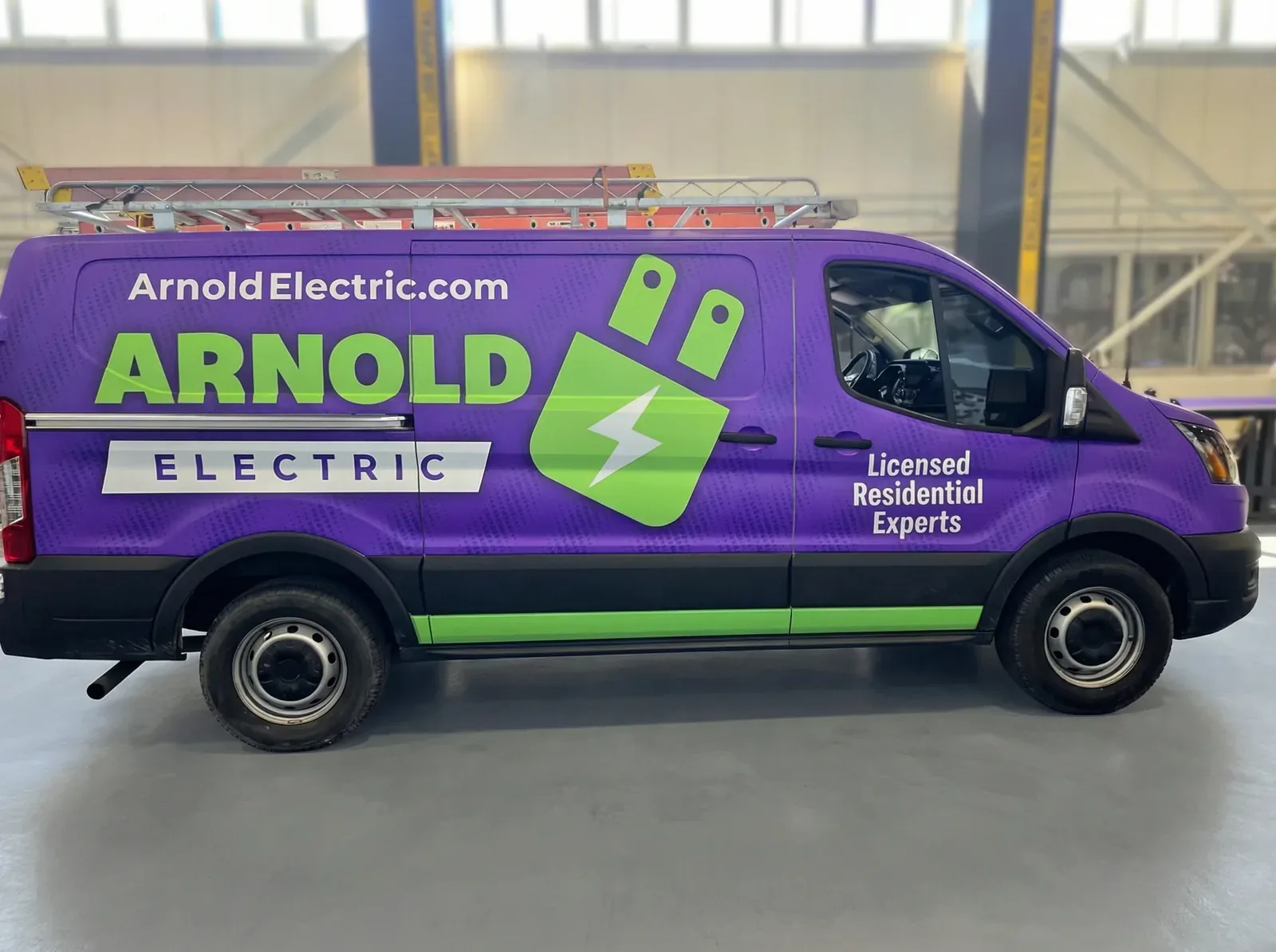 Arnold Electric purple and lime van wrapped by Chicago Fleet Wraps