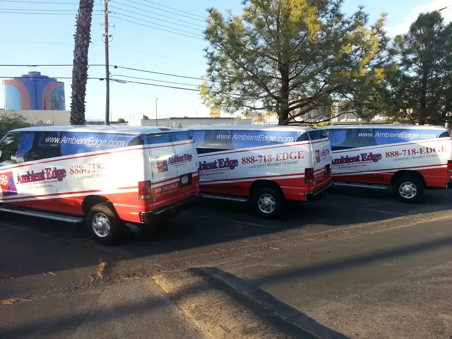 Three matched Ambient Edge HVAC vans showing fleet consistency