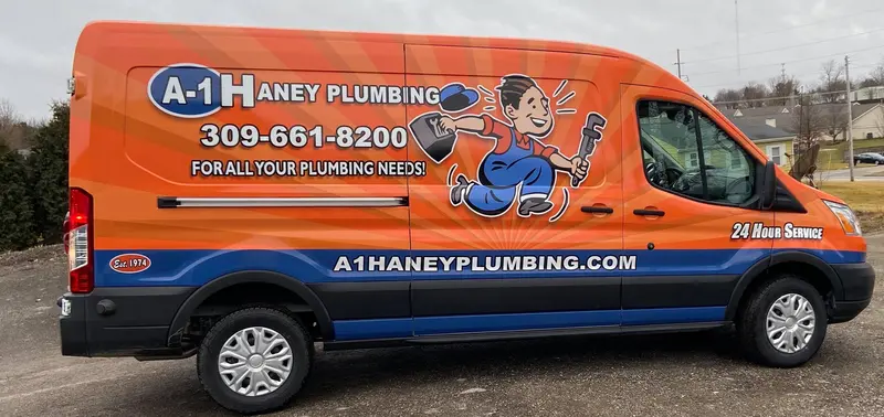 A-1 Haney Plumbing orange and blue van wrap with custom mascot illustration