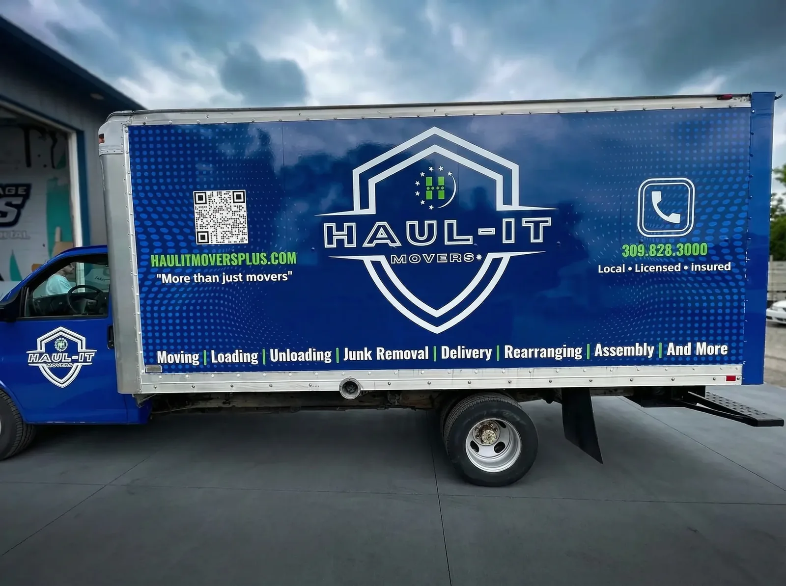 Haul-It Movers blue box truck with full vinyl wrap